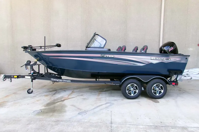 The Image of 2026 Ranger VX1788 WT boat on trailer, sleek design, dual axles, outdoor setting. - 0