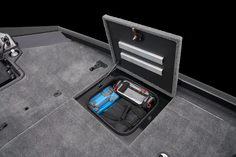 Slide: The Image of 2026 Ranger RT188P boat interior with gray and red seats under clear blue sky. - 16