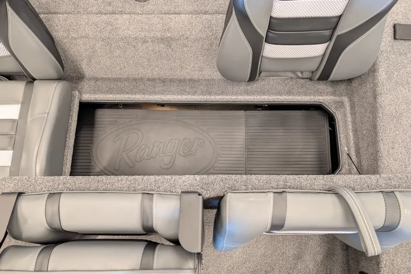 Slide: The Image of 2026 Ranger RT188 boat interior with gray seating and storage compartment. - 11