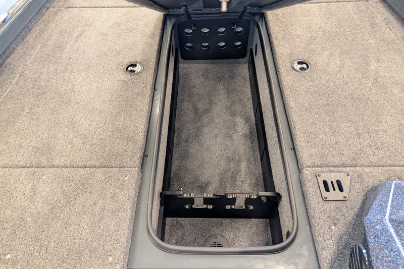 Slide: The Image of 2026 Ranger RT188 boat interior storage compartment with carpeted flooring. - 10