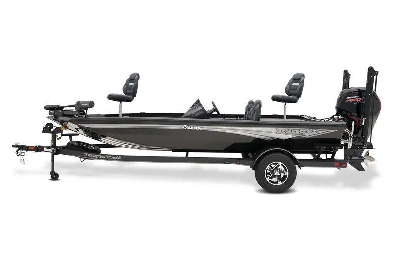 Slide: The Image of 2026 Ranger RT188P fishing boat on trailer, parked outdoors with lush greenery background. - 2