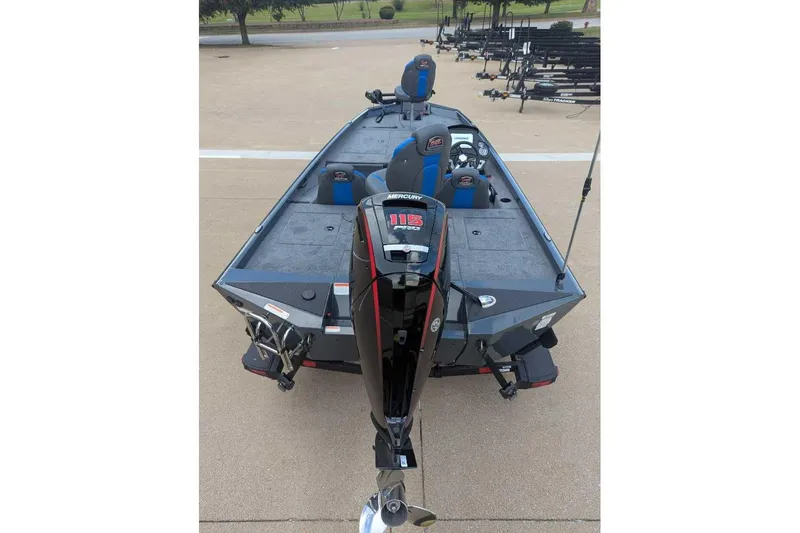 Slide: The Image of 2026 Ranger RT188P boat with Mercury 115 outboard motor, parked on concrete. - 4