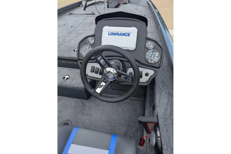 Slide: The Image of 2026 Ranger RT188P boat dashboard with steering wheel and Lowrance display. - 5