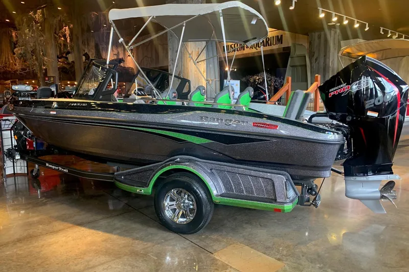 The Image of 2026 Ranger 1880MS boat with Mercury Pro XS engine displayed indoors. - 0