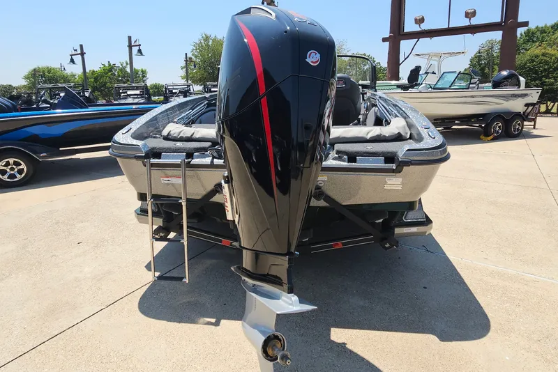 Slide: The Image of 2026 Ranger 1850MS boat with powerful outboard motor, parked outdoors on a sunny day. - 6