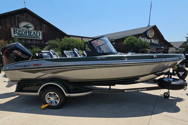 Slide: The Image of 2026 Ranger 1850MS boat displayed outdoors at a dealership. - 4