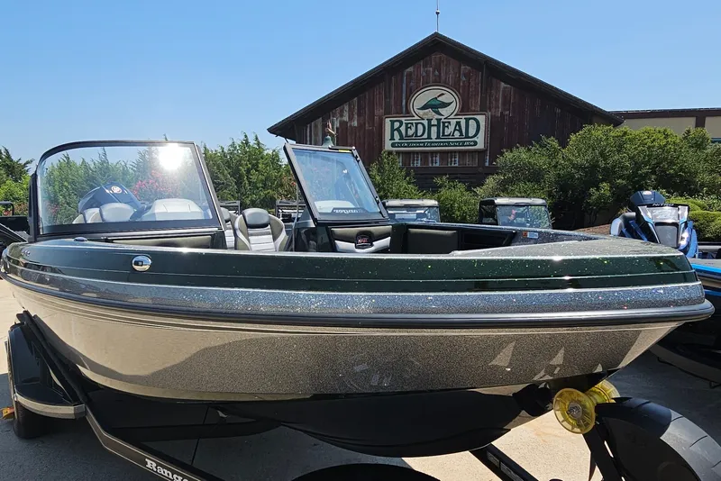 Slide: The Image of 2026 Ranger 1850MS boat displayed outdoors at RedHead store, sunny day. - 3