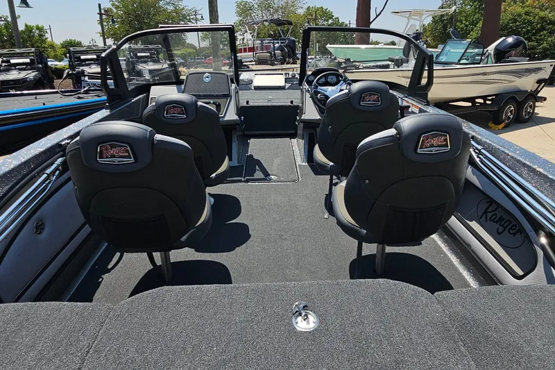 Slide: The Image of 2026 Ranger 1850MS boat interior with four seats, sleek design, and modern dashboard. - 8