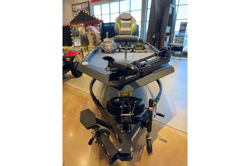 Slide: The Image of 2026 Ranger RT198P fishing boat with trolling motor in showroom display. - 3