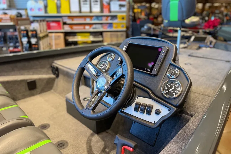 Slide: The Image of 2026 Ranger RT198P boat dashboard with steering wheel, gauges, and control panel. - 5