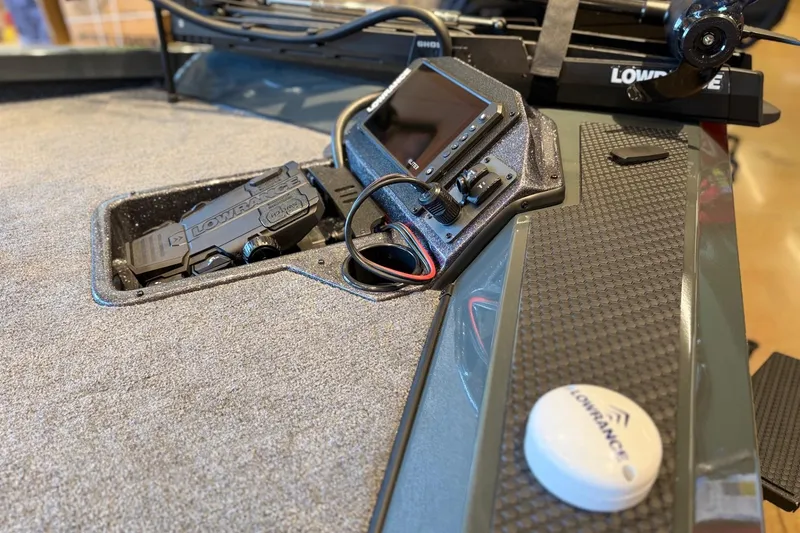 Slide: The Image of 2026 Ranger RT198P boat dashboard with Lowrance electronics and textured surface. - 6