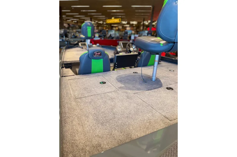 Slide: The Image of 2026 Ranger RT198P boat interior with gray carpet and adjustable seating. - 69