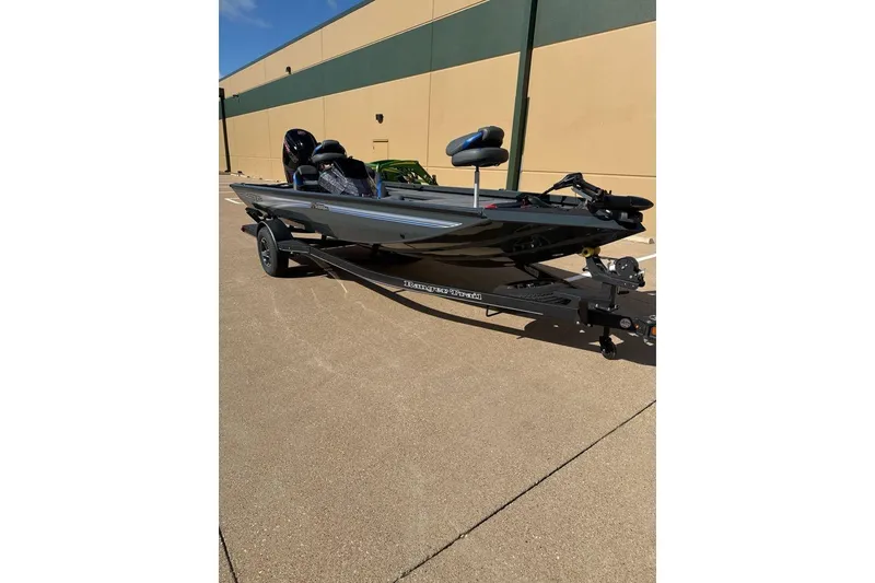 Slide: The Image of 2026 Ranger RT188C boat on trailer, parked outdoors, sunny day. - 1