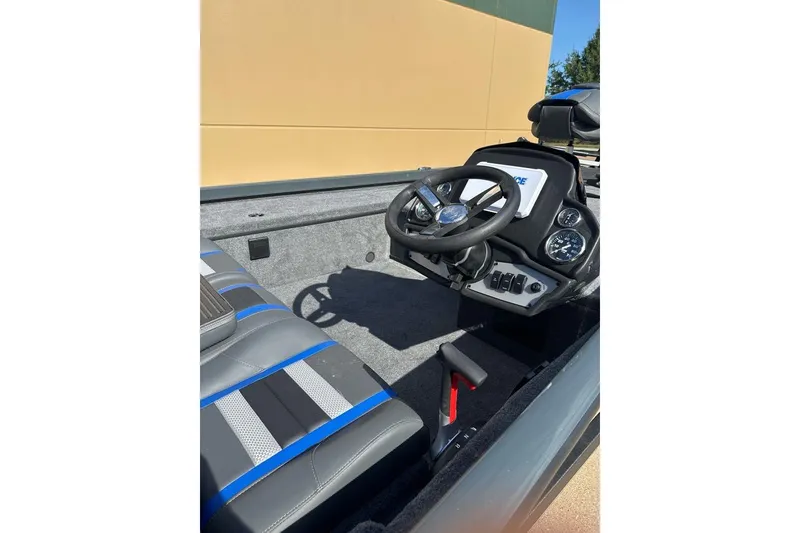 Slide: The Image of 2026 Ranger RT188C boat interior with steering wheel and dashboard controls. - 3