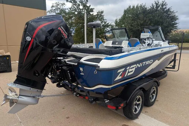 Slide: The Image of 2026 Nitro ZV19 Sport Pro boat with powerful outboard motor on a trailer. - 2