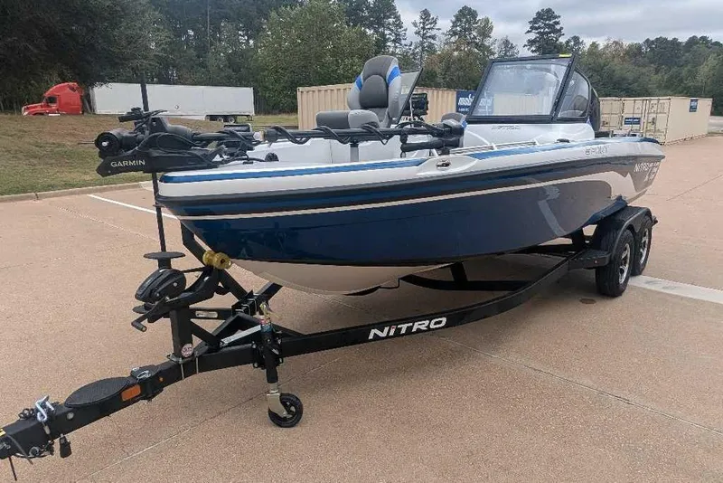 Slide: The Image of 2026 Nitro ZV19 Sport Pro boat on trailer in parking lot. - 3