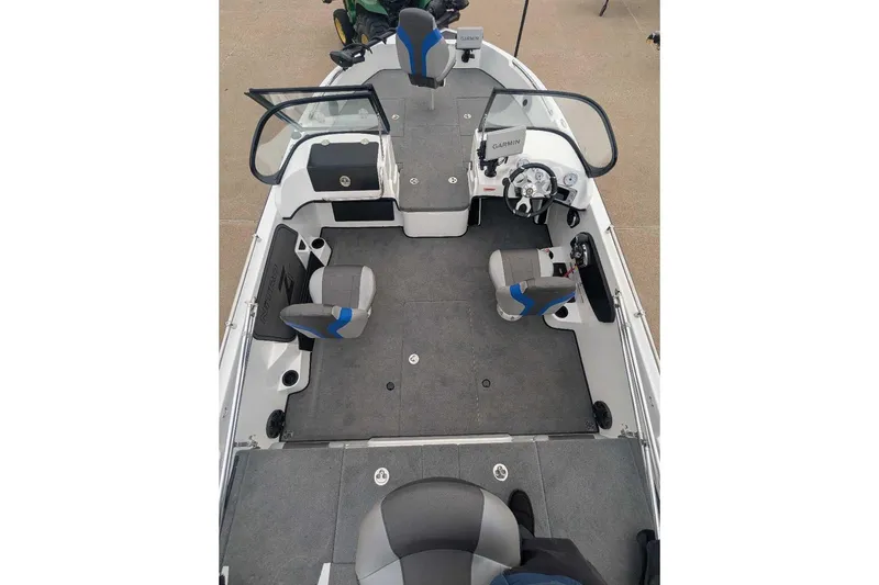 Slide: The Image of 2026 Nitro ZV19 Sport Pro boat interior with seating and steering console. - 7