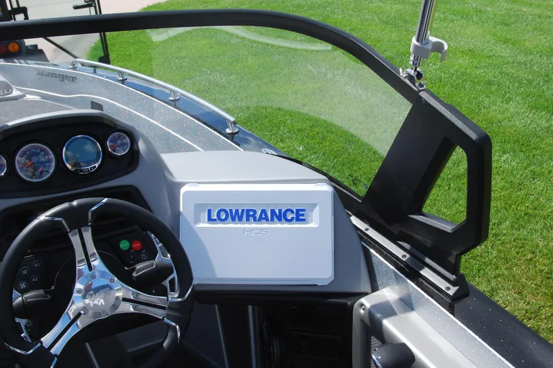 Slide: The Image of 2026 Ranger 621FS Cup Equipped boat dashboard with Lowrance HDS system and steering wheel. - 14