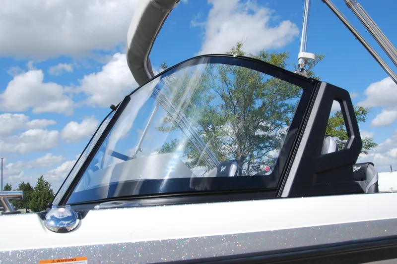Slide: The Image of 2026 Ranger 621FS Cup Equipped boat windshield under blue sky with clouds. - 15