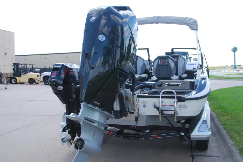 Slide: The Image of 2026 Ranger 621FS Cup Equipped boat with powerful outboard motor, parked outdoors. - 3