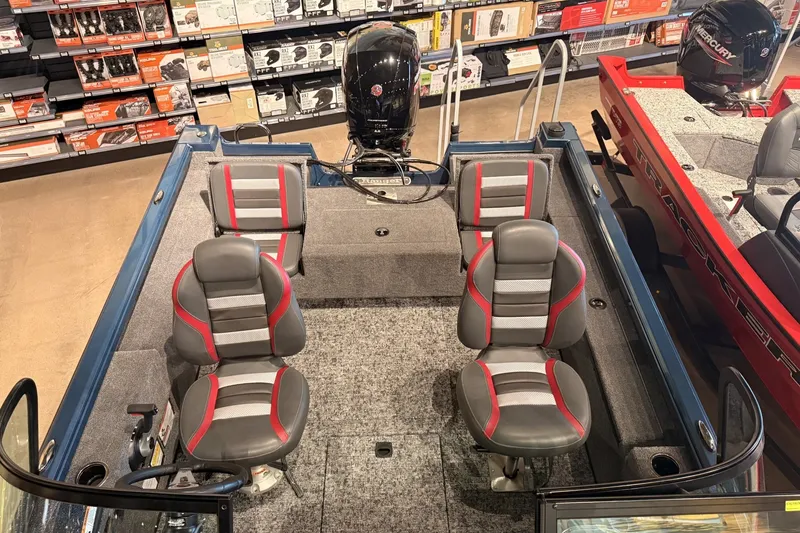 Slide: The Image of 2026 Ranger RT178 boat interior with four seats, displayed in a showroom. - 7