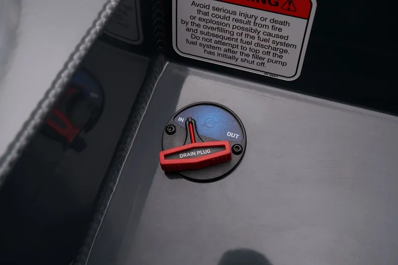 Slide: The Image of 2026 Ranger RT178 drain plug with warning label, emphasizing safety and functionality. - 5