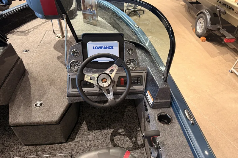 Slide: The Image of 2026 Ranger RT178 boat cockpit with steering wheel and Lowrance display. - 10