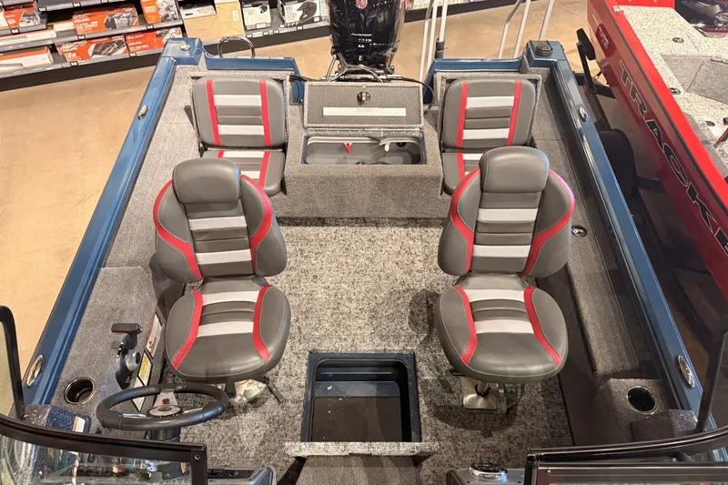 Slide: The Image of 2026 Ranger RT178 boat interior with four gray and red seats, steering wheel, and storage compartments. - 8