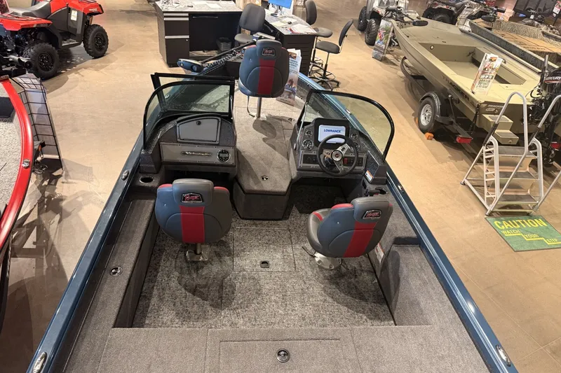 Slide: The Image of 2026 Ranger RT178 boat interior with dual seats and modern dashboard in showroom. - 6