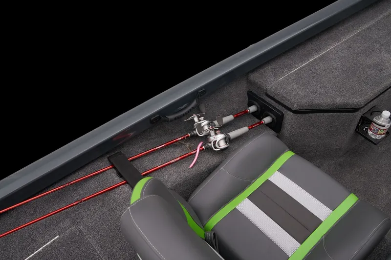 Slide: The Image of 2026 Ranger RT178 boat interior with fishing rods, gray and green seating, and storage compartment. - 11