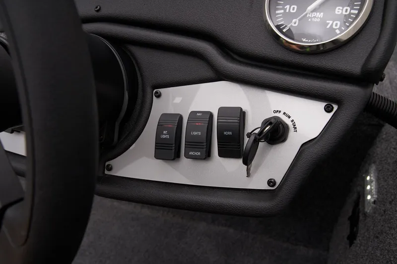 Slide: The Image of Control panel of 2026 Ranger RT178 boat with switches and ignition key. - 17