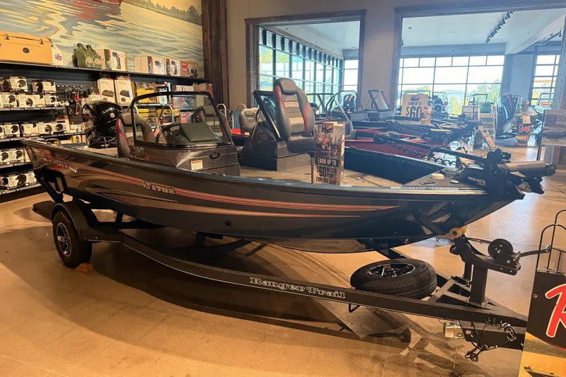 Slide: The Image of 2026 Ranger RT178 boat displayed in a showroom with accessories and promotional signs. - 3