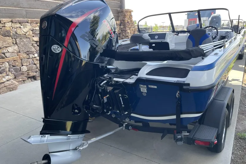 Slide: The Image of 2026 Nitro ZV19 Sport Pro boat with powerful outboard motor, parked on a trailer. - 2