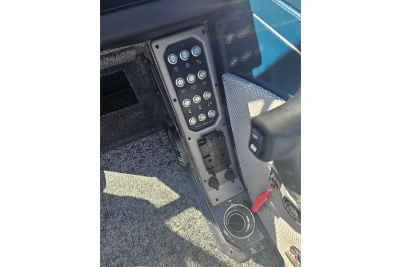 Slide: The Image of Control panel of 2026 Ranger VX1788 WT boat with various switches and buttons. - 12