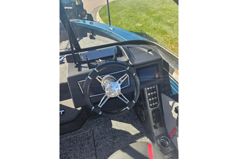 Slide: The Image of 2026 Ranger VX1788 WT boat dashboard with steering wheel and control panel. - 5