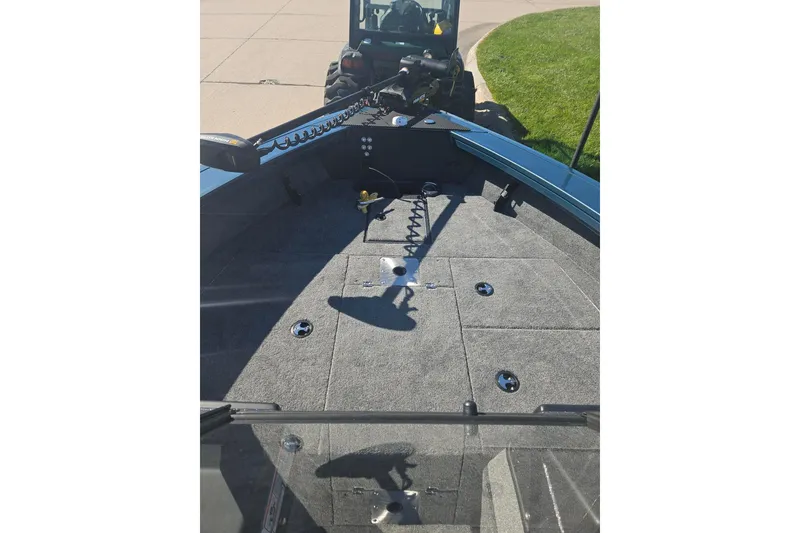 Slide: The Image of 2026 Ranger VX1788 WT boat interior with carpeted deck and storage compartments. - 6