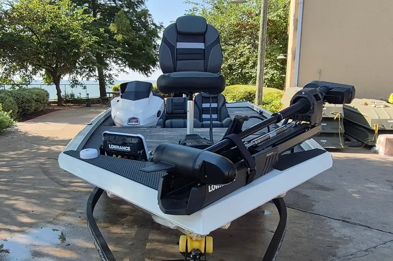 Slide: The Image of 2026 Ranger RT188C fishing boat with Lowrance equipment, parked outdoors. - 3