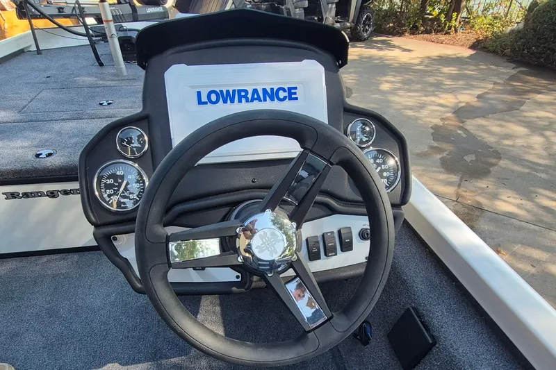 Slide: The Image of Steering wheel and dashboard of 2026 Ranger RT188C boat with Lowrance display. - 11