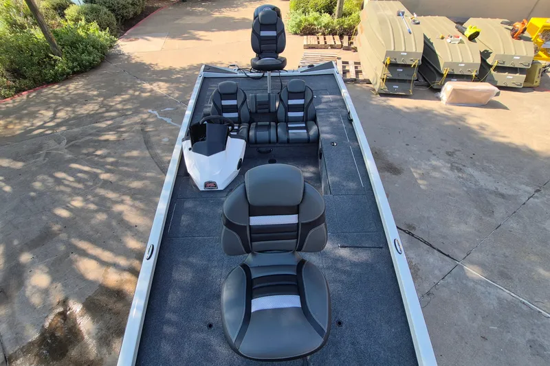 Slide: The Image of 2026 Ranger RT188C boat interior with multiple seats and steering console. - 13
