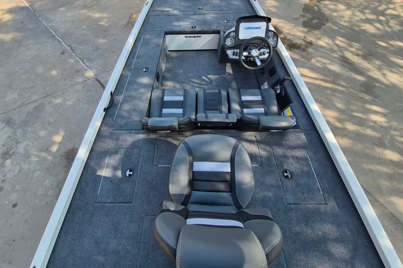 Slide: The Image of 2026 Ranger RT188C boat interior with steering console and seating, featuring a Lowrance system. - 10