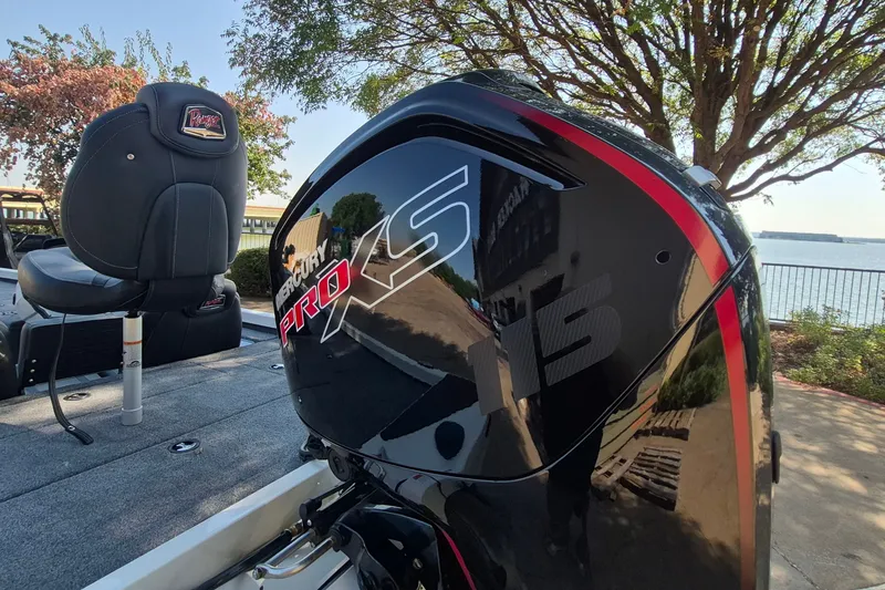 Slide: The Image of 2026 Ranger RT188C boat with Mercury Pro XS engine, docked by a scenic lakeside. - 9