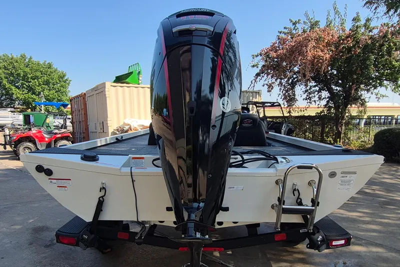 Slide: The Image of 2026 Ranger RT188C boat with powerful outboard motor, parked outdoors. - 7