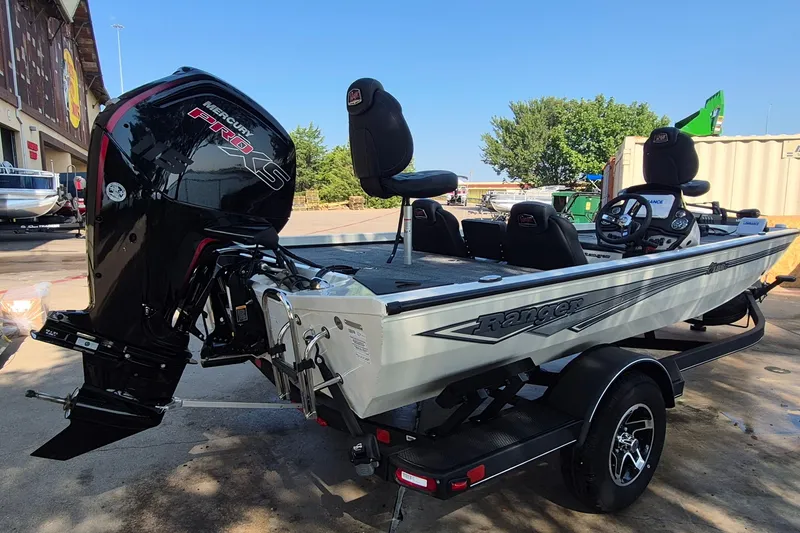 Slide: The Image of 2026 Ranger RT188C fishing boat with Mercury Pro XS engine, parked outdoors. - 6