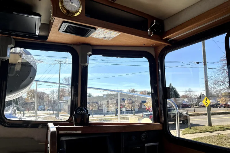Slide: The Image of Interior view of 2013 Ranger Tugs R-27 boat with windows and compass. - 26