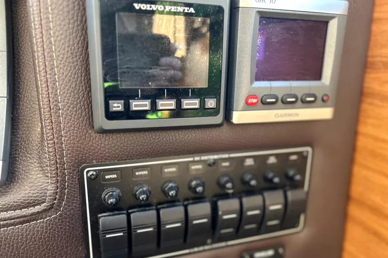 Slide: The Image of Control panel of a 2013 Ranger Tugs R-27 with Volvo Penta and Garmin displays. - 31