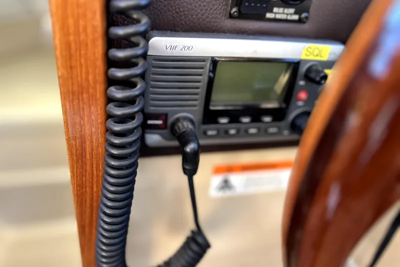 Slide: The Image of VHF 200 radio on 2013 Ranger Tugs R-27 boat dashboard. - 33