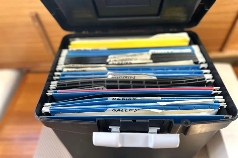 Slide: The Image of Filing box with organized folders for Ranger Tugs R-27, 2013 model. - 37