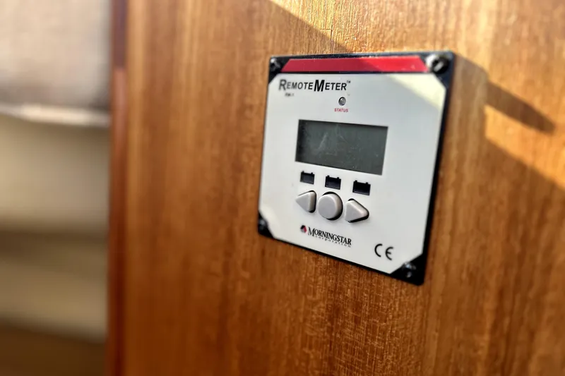 Slide: The Image of Remote meter on 2013 Ranger Tugs R-27 boat interior, mounted on wooden panel. - 52