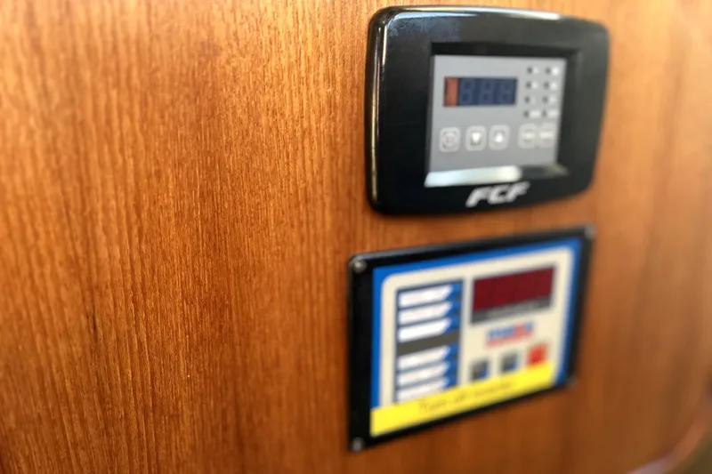 Slide: The Image of Control panels on 2013 Ranger Tugs R-27 wooden interior. - 53