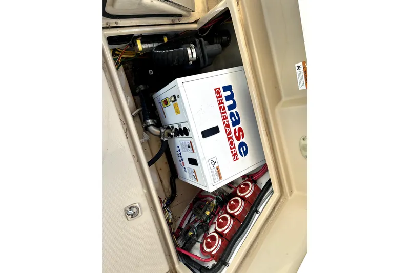 Slide: The Image of Engine compartment of 2013 Ranger Tugs R-27 with Mase generator and wiring. - 57